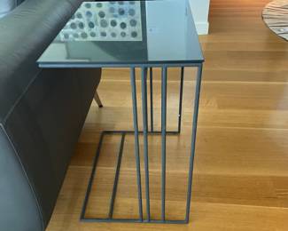 $120 Glass and metal base side table. 20” x 15” x 24” h.