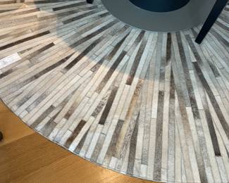 $780 BoConcept round leather/hide rug. 7’3” dia.