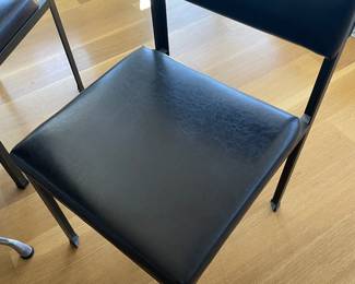 $400 Four leather and metal side/dining chairs. Very solid. 17”w X 19”d X 30”h.