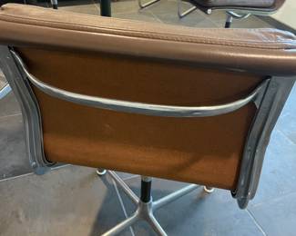 Back of chair with unique/signature pull bar.