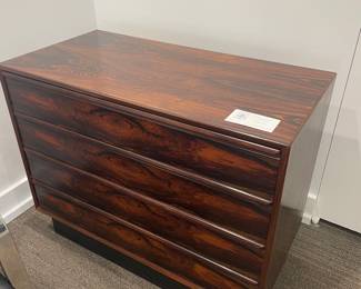 $440 Rosewood veneer four drawer dresser sold with matching bedside tables. Dresser measures 36w X 18d X 29h.. Bedside tables are 20..5w X 15,75d X 20”h.