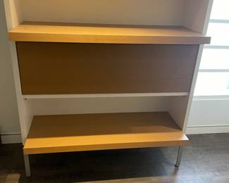 Storage chest shown with two of the drawers extended as shelves.