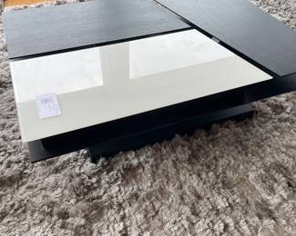 $650 BoConcept modern, adjustable coffee table. This photo shows the table flat. 44” X 31.5” X 13” h with the adjustable pieces flat 19” with adjustable pieces raised. 