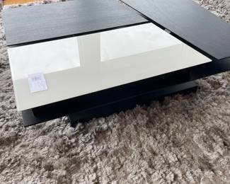 $650 BoConcept modern, adjustable coffee table. This photo shows the table flat. 44” X 31.5” X 13” h with the adjustable pieces flat 19” with adjustable pieces raised.