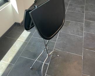 Kartell table shown folded for easy storage.