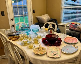 Red punch bowl with cups, platters, glass bowls. 