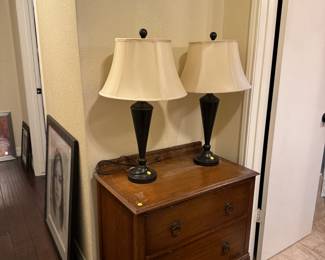 Antique chest, Lamps, Hsllway with pictures are frames. 