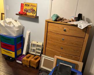 Chest of drawers, shoe kits, floating wall shelves in white. Plastic storage bins for Legos. 
