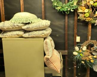 Door wreaths and outdoor pillows. 