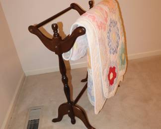 Antique quilt on a nice quilt stand