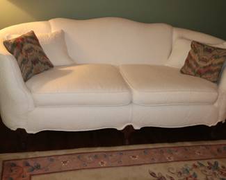 Antique sofa c.1900 newly upholstered in white matelasse' fabric