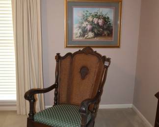Wonderful antique heavy rocking chair in primary bedroom