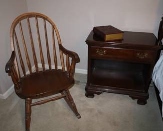One of suite, open bottom nightstand; with a windsor shape rocker in primary bedroom