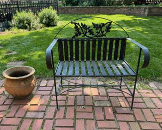 Nice iron garden bench and terracotta pot.