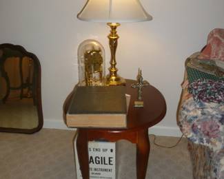 Matching end table, large bible, another clock, matching lamp