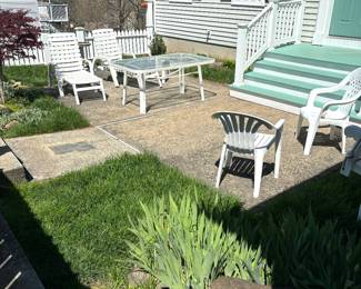 Patio furniture two nice white sets. Tables and chairs. Folding chairs also