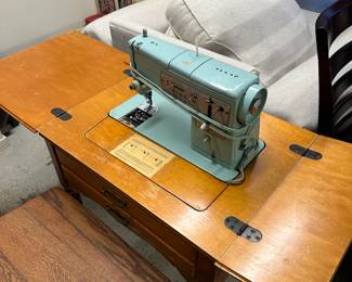 Vintage Singer sewing machine and table.