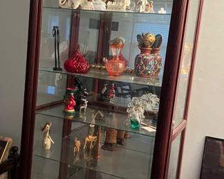 1 of 2 identical curio cabinets. Contents also for sale.