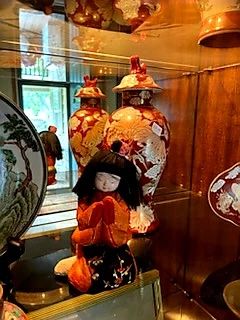 Asian art, in the Drexel cabinet as you enter this home.  Is she praying? and for what?  World peace? Another grilled cheese sandwich?  
