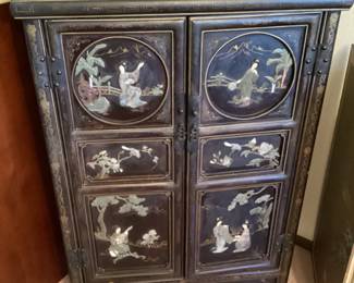Chinese black lacquered two door cabinet