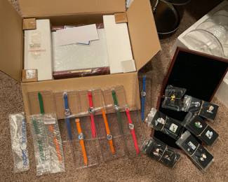 Willabee & Ward "The Peanuts Watch Collection" set of 12 watches, 1 for each month / Willabee & Ward Peanuts pin collection. Both have display cases