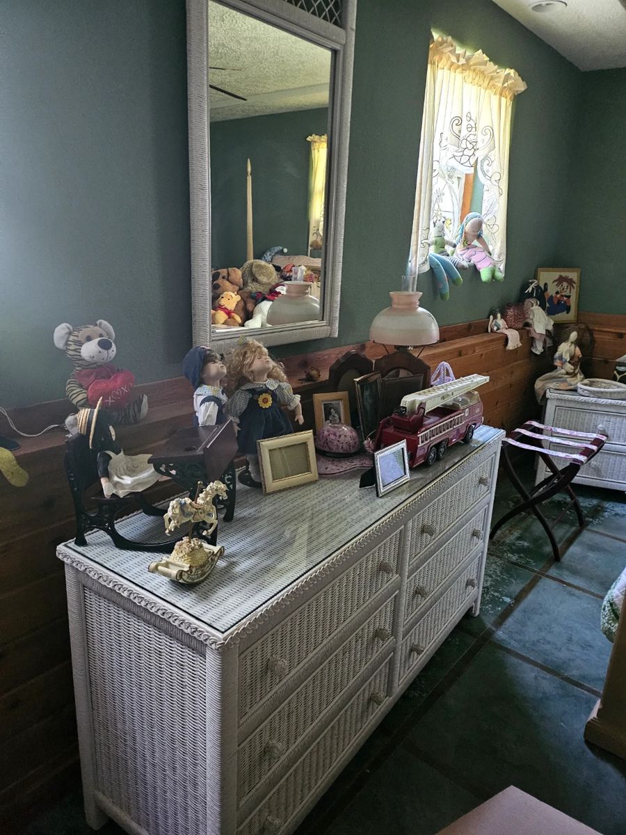 Glass top wicker dresser with mirror.