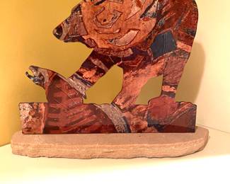 Enameled metal on sandstone