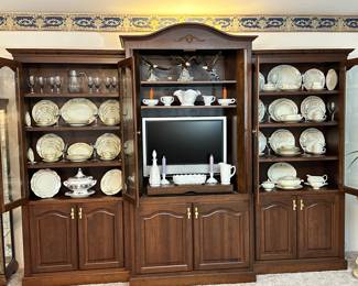 Amish Made Cherry, 3 Piece Wall-Unit. Both Side haves Glass doors for display & Protection, Filled with:
Homer Laughlin China
Other China
Crystal&nbsp;
Center Unit has a Sony, Flat Screen TV
and Westmoreland, Milk Glass.
Porcelain Eagles&nbsp;
