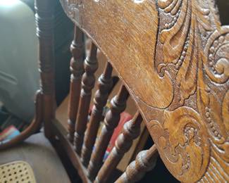 Oak carved back side chair, circa 1900, with can seat.