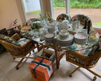 Wicker dining table w/6 chairs, one of 2 sets of dishes