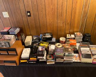 Table full of CD's, DVD's.and more