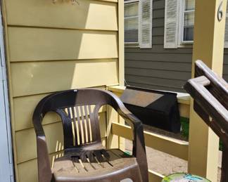 Plastic lawn chair, Butterfly glass table, Various lawn ornaments 
