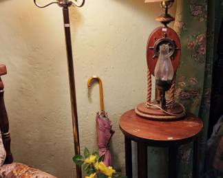 Side chair, Umbrella, Decorative nautical themed lamp, Wood side table