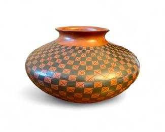 This Casa Grandes pot was made by the pinch method and individually fired.  Artist Olga Quezada from the village of Juan Mata Ortiz in Chihuahua, Mexico.