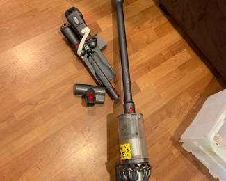 #132 Dyson cyclone v10 w/attachments & Wall Hanging unit - working $150.00
