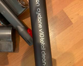 #132 Dyson cyclone v10 w/attachments & Wall Hanging unit - working $150.00