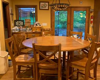 #16 oak high top table with drop leaves around to square with 8 chairs 46-56x36T as is finish $225.00