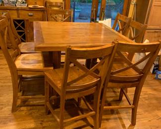 #16 oak high top table with drop leaves around to square with 8 chairs 46-56x36T as is finish $225.00