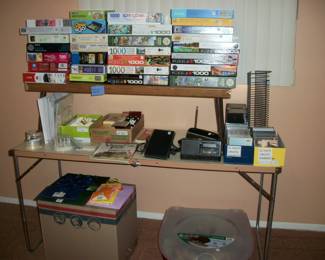 lots of puzzles, gift wrap, gift bags, ribbon