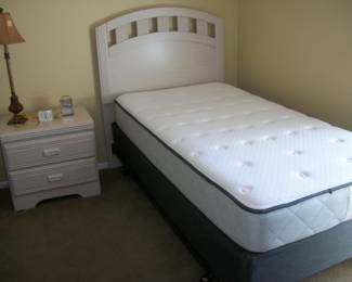 night stand, lamp, clocks, twin bed