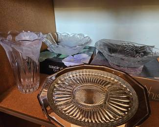 Lots of serveware, platters, cake plates, and vases in the original boxes. Silver, glass, and crystal