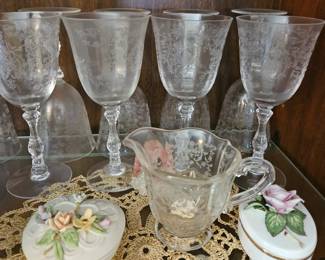 Those 8 glasses are part of a high end 18 piece set which includes 8 white wine glasses, 8 red wine glasses, a beautiful bell and a pitcher. 