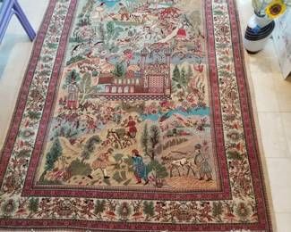 100% wool handwoven rug is approximately 8 ft. x 5 ft. 