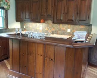 Rustic wet bar crafted from antique planks - incredible cabinetry