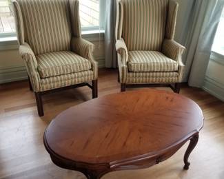 Pair of stylish wingback arm chairs; sorry, coffee table is sold
