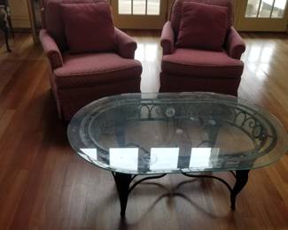 Pair of cozy swivel chairs; coffee table