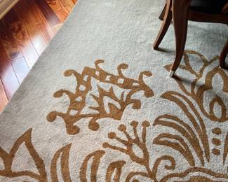 pale blue rug with brown design