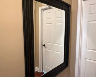 large dark frame rectangular mirror