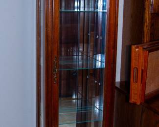 Elegant wooden display case with glass shelving