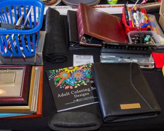 Assortment office supplies and frames 